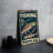 a fishing sign on a table next to a pair of binoculars