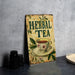 a sign with a cup of tea on top of a table