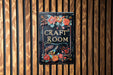 a sign on a wooden wall that says craft room