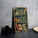 a sign that reads read and relax next to a stack of books