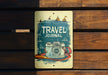 a sign that says travel journal on it