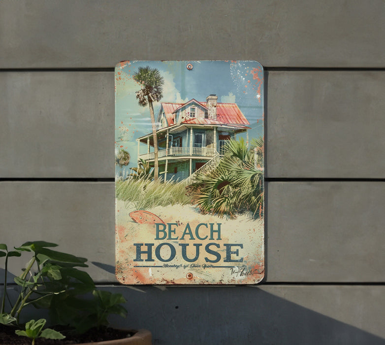a sign on the side of a building that says beach house