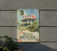 a sign on the side of a building that says beach house