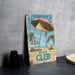 a beach club sign sitting on top of a table