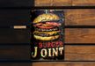 a metal sign that says burger joint on it