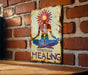 a sign on a brick wall with a woman doing yoga