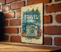 a sign on a brick wall that says travel journal
