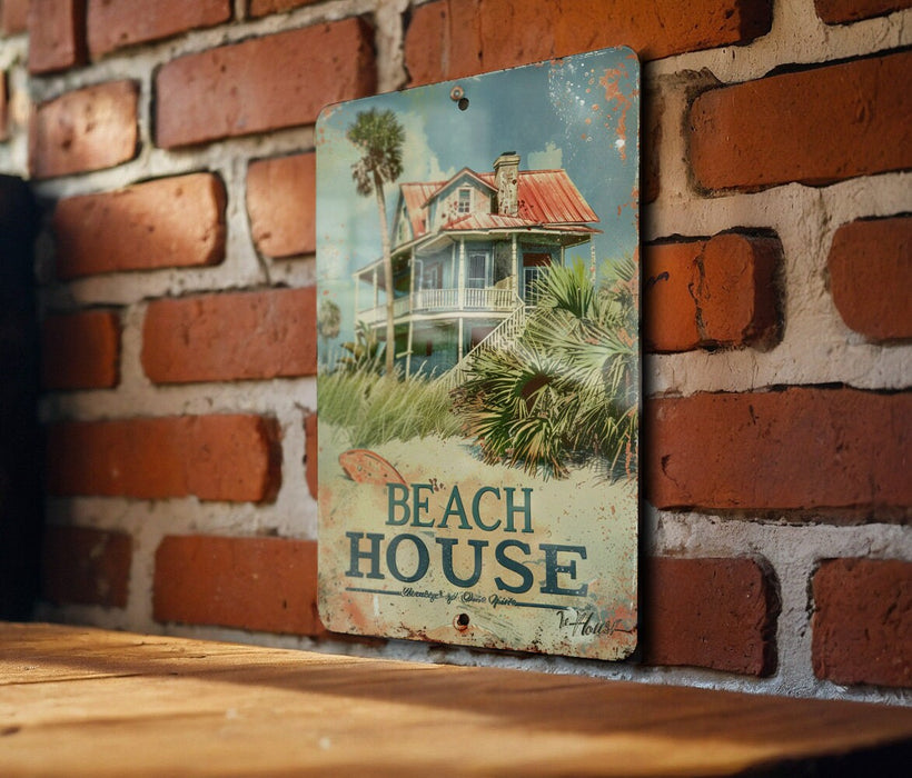 a sign on a brick wall that says beach house