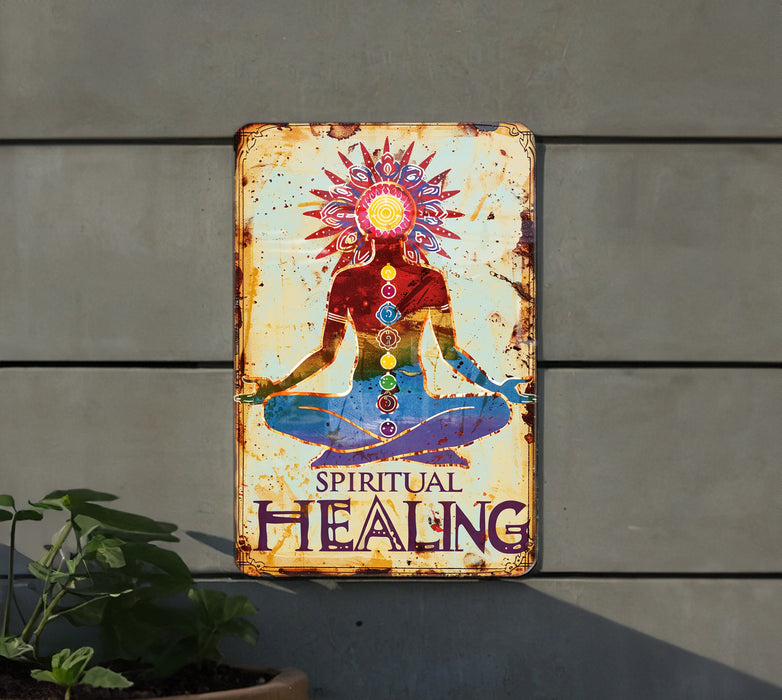 a metal sign with a picture of a woman doing yoga