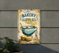 a sign on the side of a building advertising bakery supplies