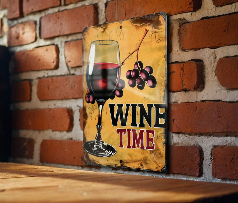 a wooden table topped with a glass of wine