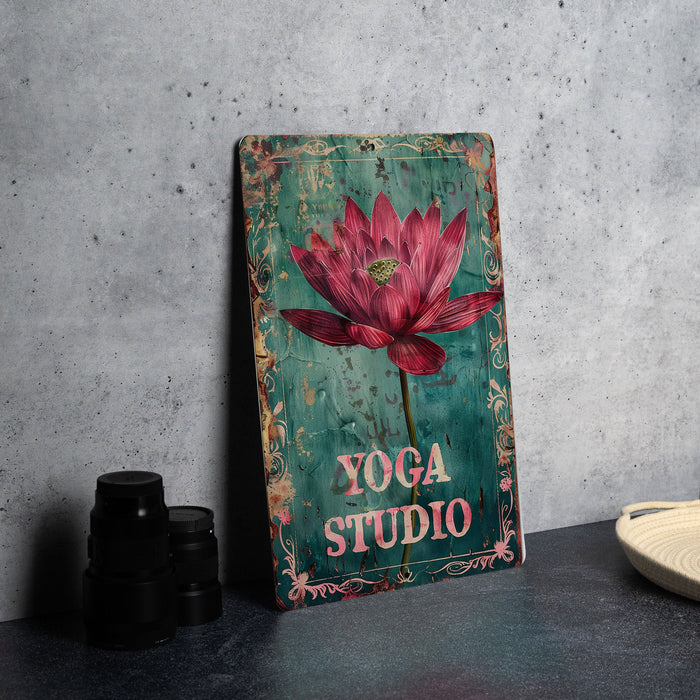 a picture of a yoga studio sign on a table