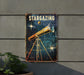 a metal sign with a telescope on it
