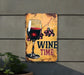 a sign with a glass of wine on it
