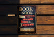 a book nook sign on a wooden bench