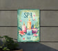 a sign that says spa day with candles and flowers