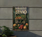 a sign that says produce stand on the side of a building