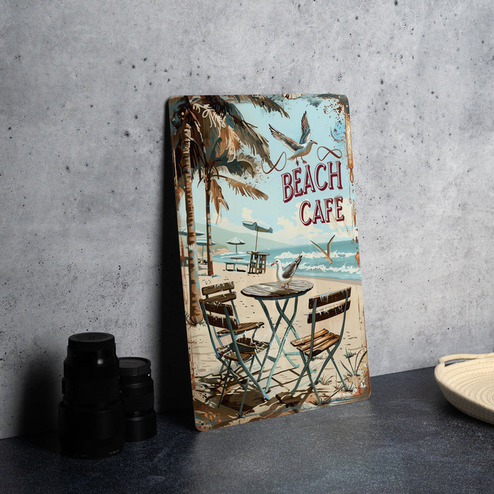 a table with two chairs and a sign that says beach cafe