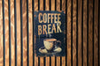 a sign on a wooden wall that says coffee break