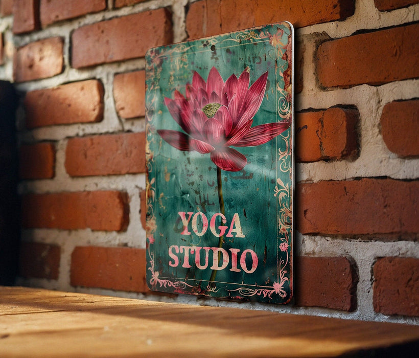 a sign on a brick wall that says yoga studio