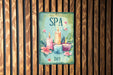a sign that says spa day with candles and flowers