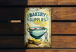 a sign on a wooden wall advertising bakery supplies