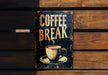 a sign on a wooden wall that says coffee break