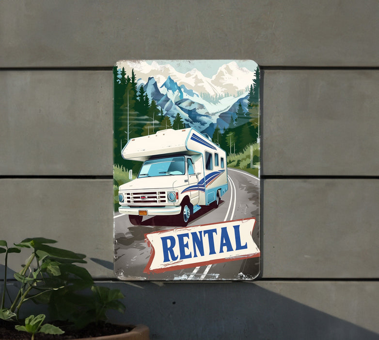 a metal sign with a picture of a camper on the side of a building