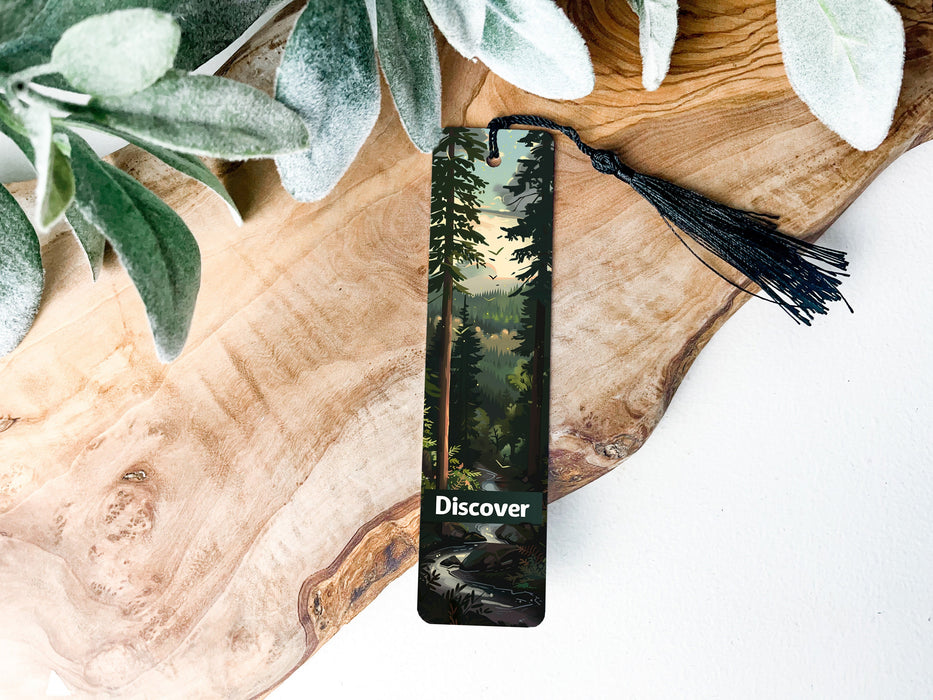 a bookmark with a picture of a forest on it