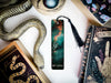 a bookmark with a picture of a snake on it