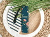 a close up of a plate with a bookmark