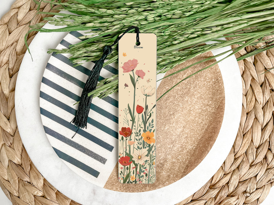 a bookmark sitting on top of a plate next to a plant