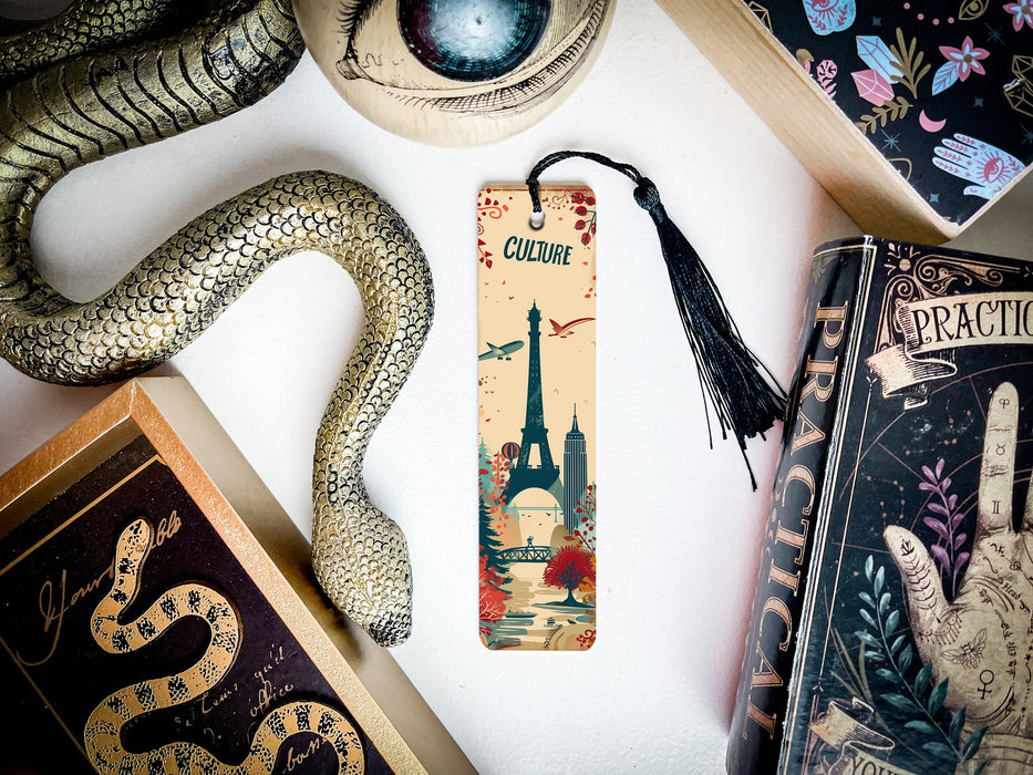 a bookmark with a picture of a city and a snake on it