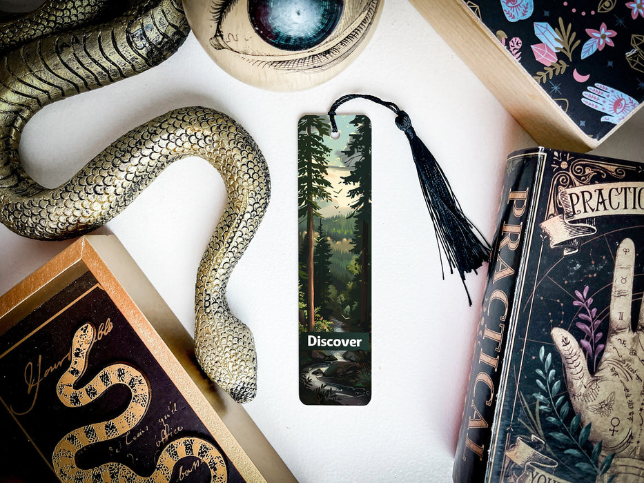 a snake, a bookmark, and other items on a table