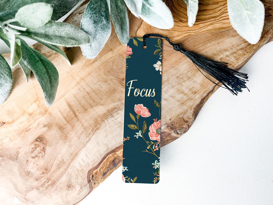 a bookmark sitting on top of a wooden table