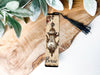 a bookmark with a picture of a lamp on it