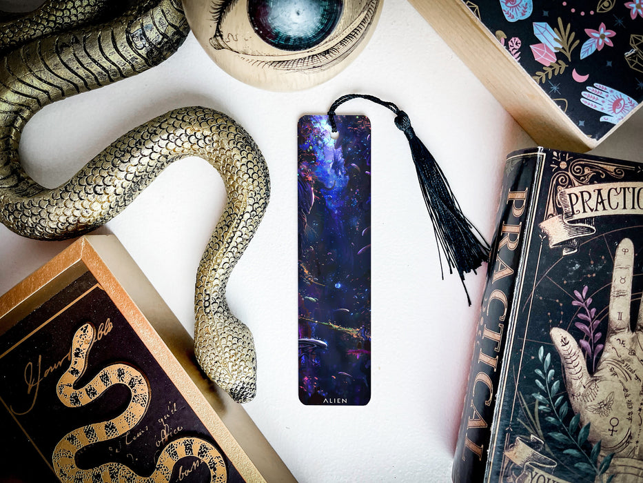 a bookmark, snake, and other items on a table
