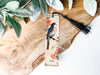 a bookmark with a bird sitting on a branch