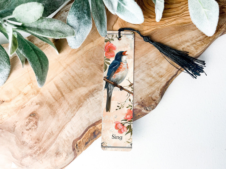 a bookmark with a bird sitting on a branch