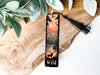 a bookmark with a picture of a forest on it