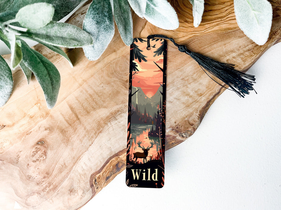 a bookmark with a picture of a forest on it