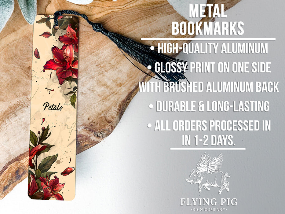 a metal bookmark with red flowers on it