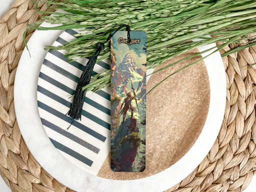 a bookmark on a plate next to a bunch of grass