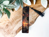 a bookmark with a picture of a sunset on it