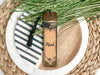 a table setting with a book and a plant