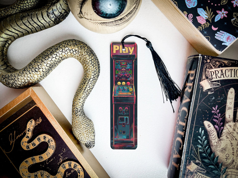 a snake, a bookmark, and other items on a table