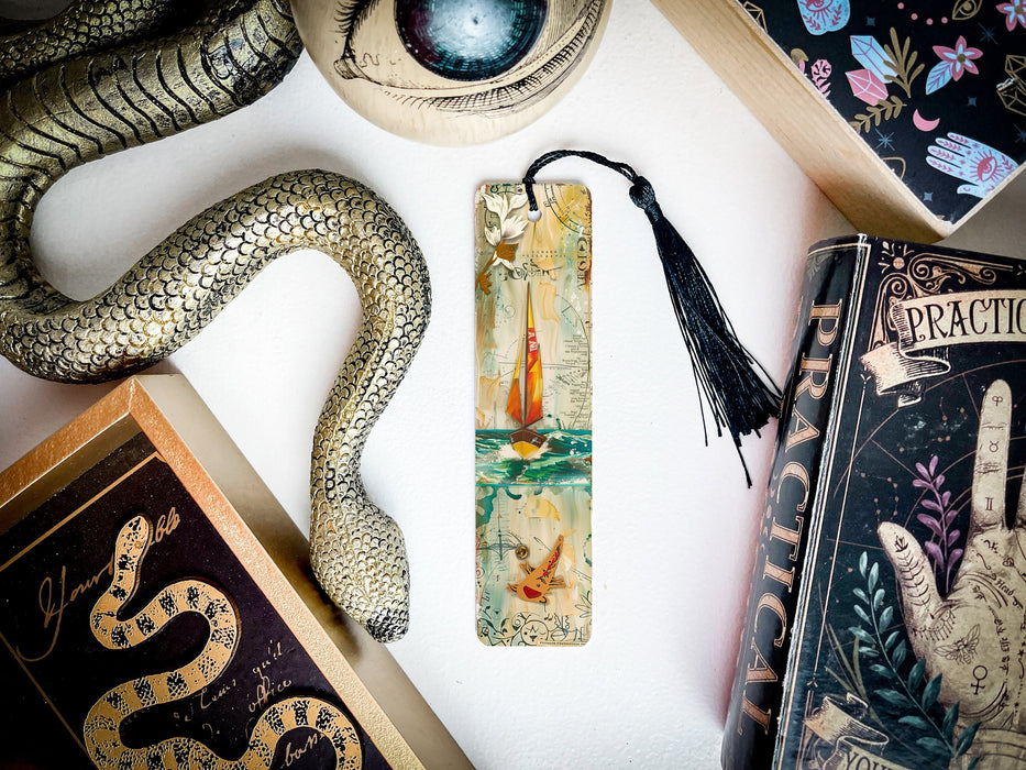 a bookmark, snake, and other items on a table