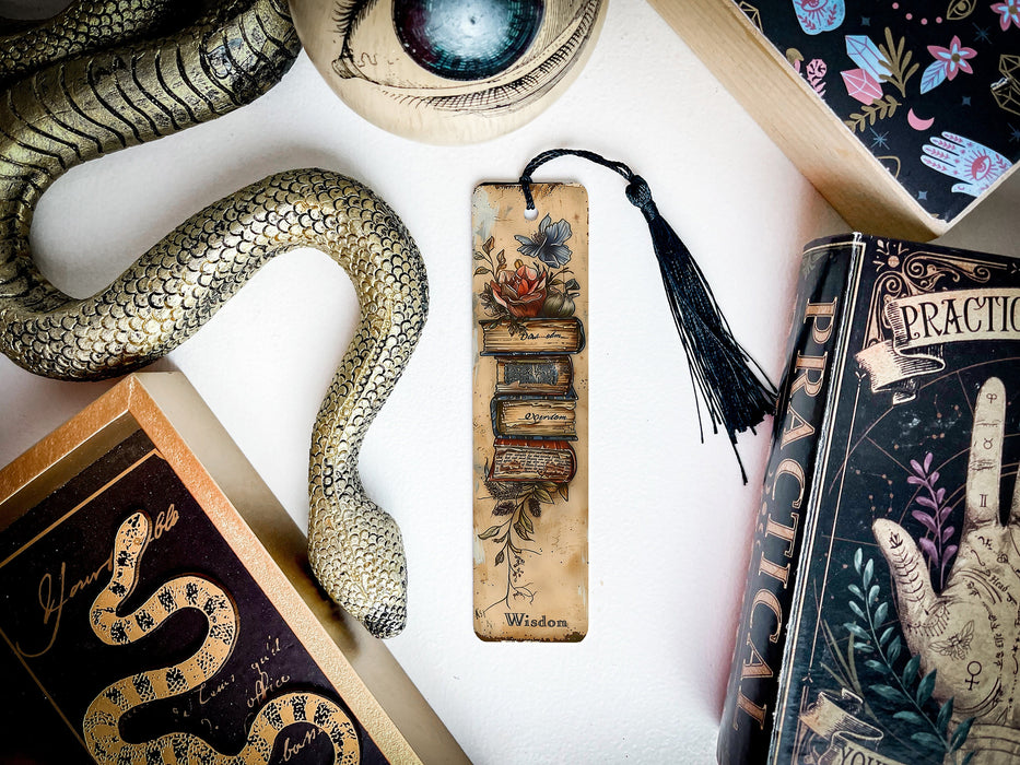 a collection of decorative items including a bookmark, snake, and other items