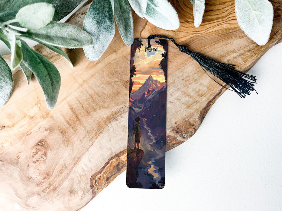 a bookmark with a picture of a man standing on a mountain