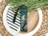 a bookmark sitting on top of a white plate